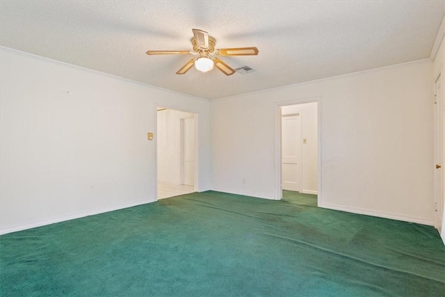 carpeted empty room featuring crown molding, ceiling fan, and a textured ceiling