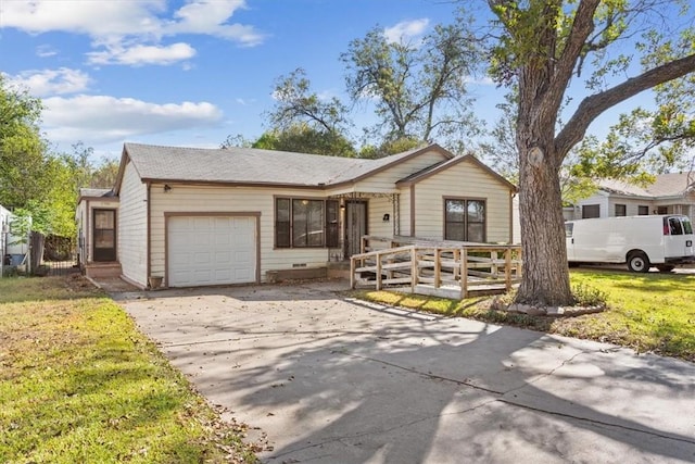 single story home with a front yard and a garage