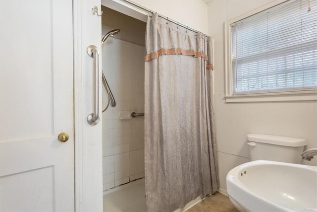 bathroom with tile patterned flooring and a shower with curtain