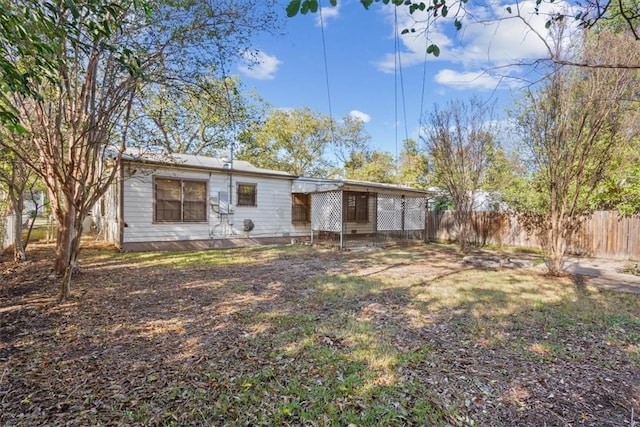 back of house with a yard