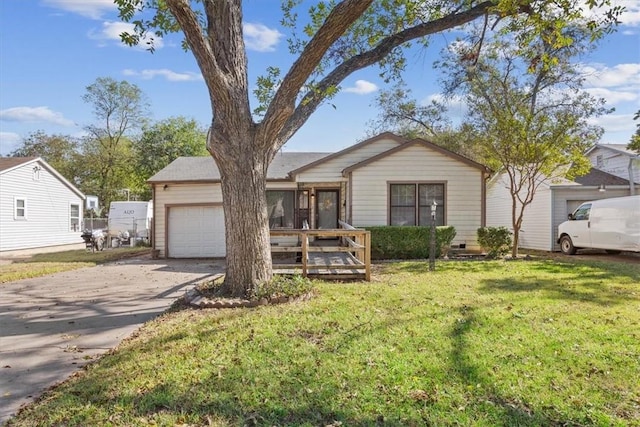 view of front of home featuring a garage and a front lawn