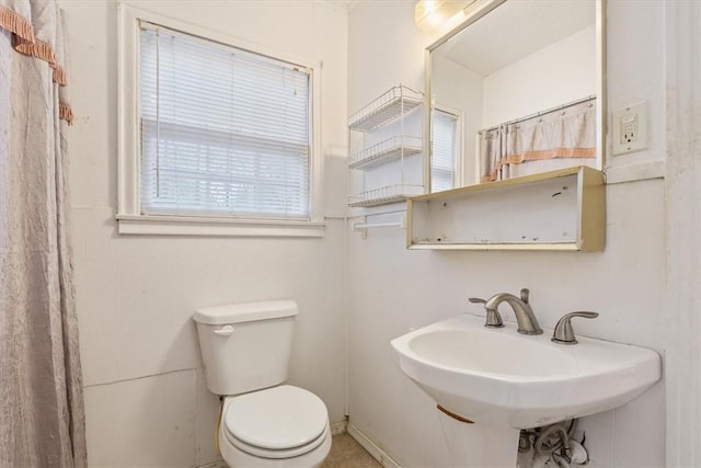 bathroom featuring toilet and sink