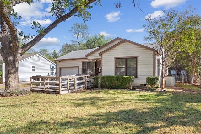 ranch-style home with a front yard and a garage