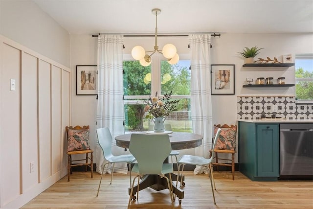 dining room featuring light hardwood / wood-style floors and an inviting chandelier