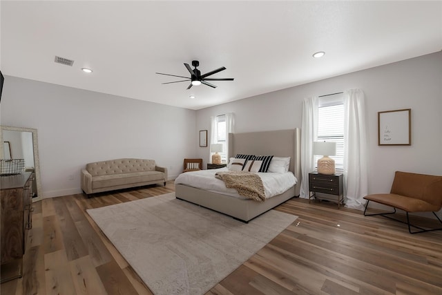 bedroom with hardwood / wood-style flooring and ceiling fan