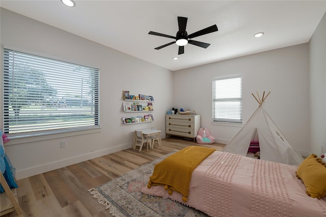 bedroom featuring ceiling fan and light hardwood / wood-style floors