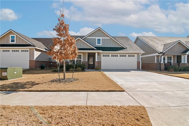 craftsman-style home featuring brick siding, roof with shingles, concrete driveway, an attached garage, and board and batten siding