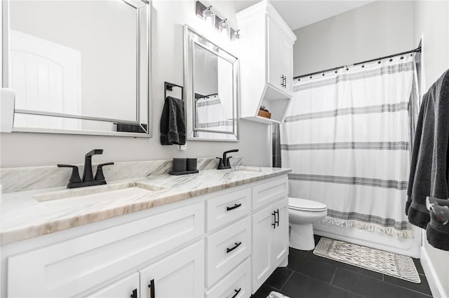 full bathroom featuring toilet, vanity, tile patterned flooring, and shower / bath combo