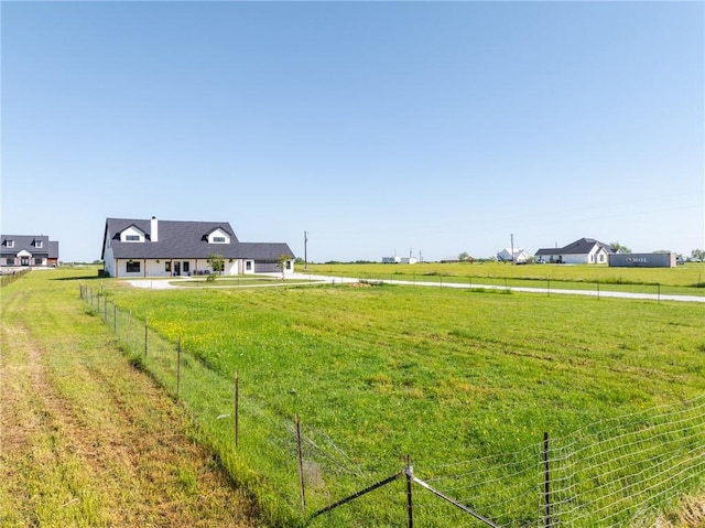 view of yard with a rural view