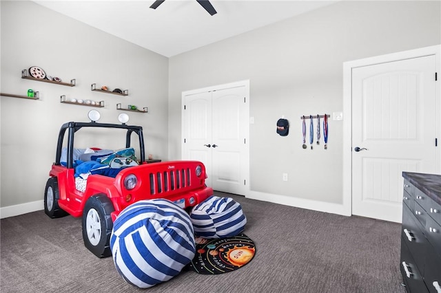 carpeted bedroom with ceiling fan and a closet