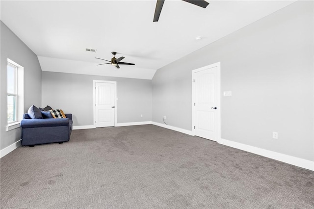 unfurnished room featuring vaulted ceiling, ceiling fan, and carpet