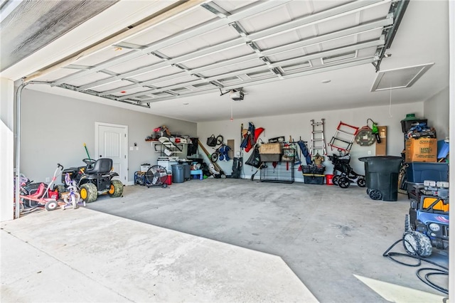 garage featuring a garage door opener