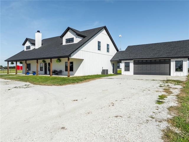 view of front of property featuring a porch and a garage