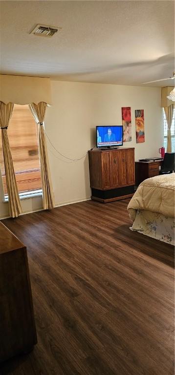 bedroom featuring dark wood-type flooring