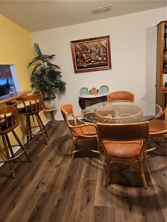 dining room with hardwood / wood-style floors