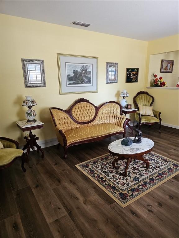 living area featuring dark hardwood / wood-style flooring