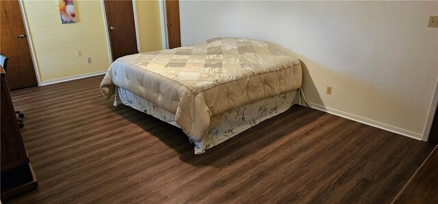 bedroom featuring dark hardwood / wood-style floors