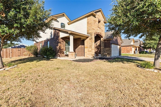 view of front of house with a garage and a front yard