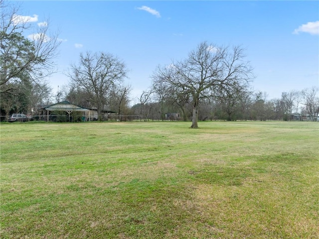 view of yard with a rural view