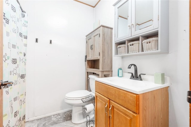 bathroom featuring toilet, vanity, and walk in shower