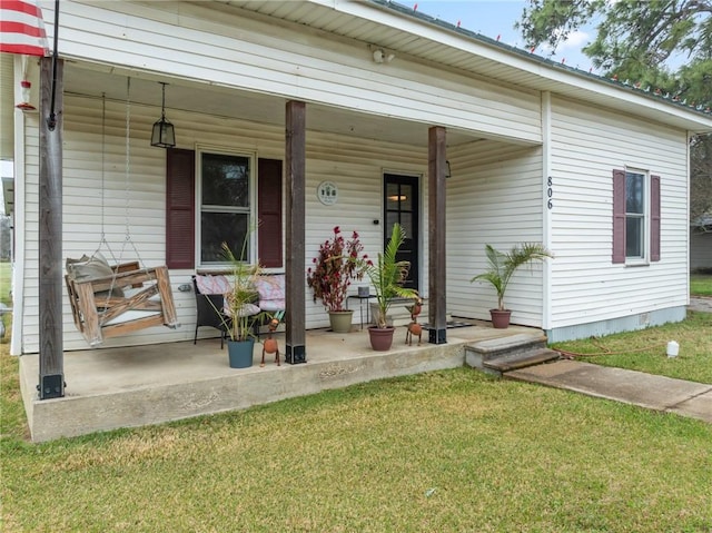 view of front of house with covered porch and a front yard