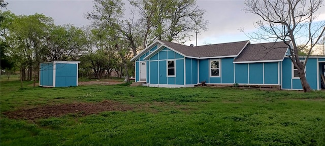 rear view of property featuring a yard