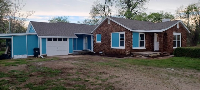 single story home featuring a garage