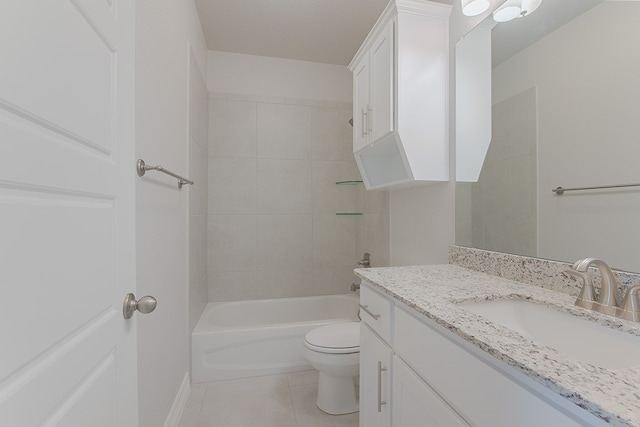 full bathroom with tile patterned floors, vanity, toilet, and tiled shower / bath combo