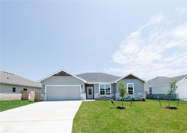 ranch-style home with a garage and a front lawn