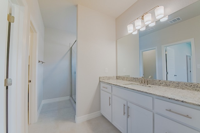 bathroom with vanity and walk in shower