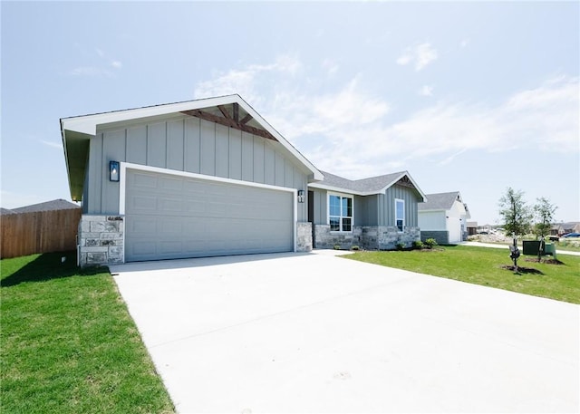 single story home with a front yard and a garage