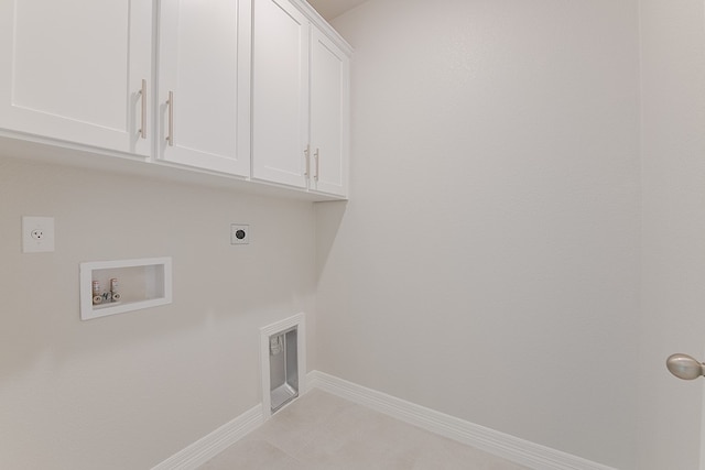 laundry room featuring hookup for an electric dryer, washer hookup, and cabinets