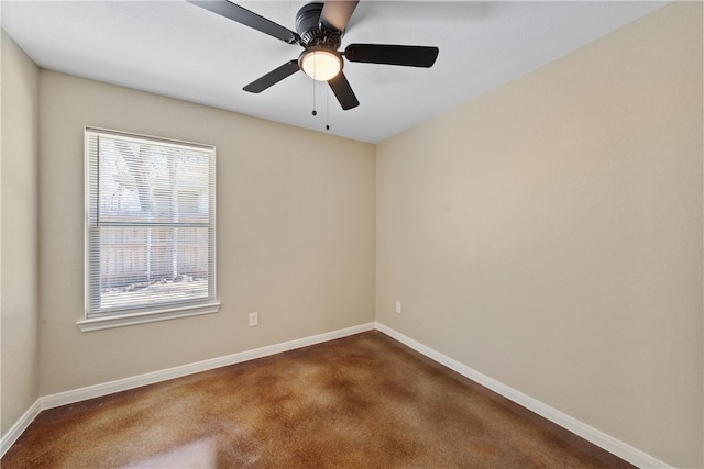 empty room featuring baseboards, dark colored carpet, and a ceiling fan