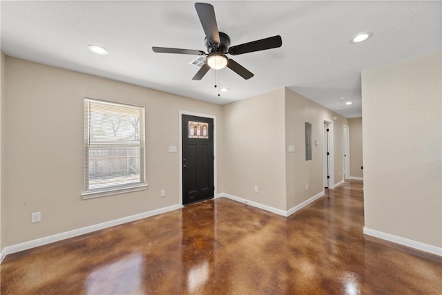 entrance foyer with concrete flooring, recessed lighting, and baseboards