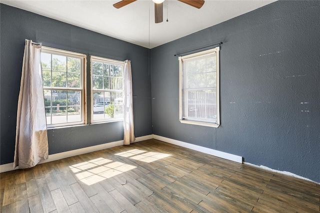 empty room featuring ceiling fan and wood-type flooring