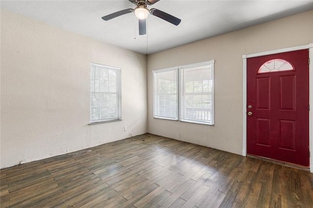 foyer entrance with dark hardwood / wood-style floors and ceiling fan