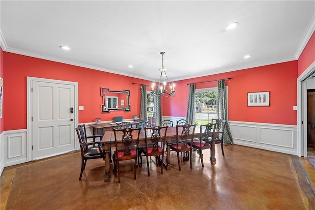 dining room featuring ornamental molding and an inviting chandelier