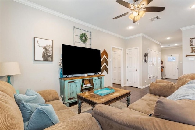 living room featuring ceiling fan, light hardwood / wood-style floors, and ornamental molding