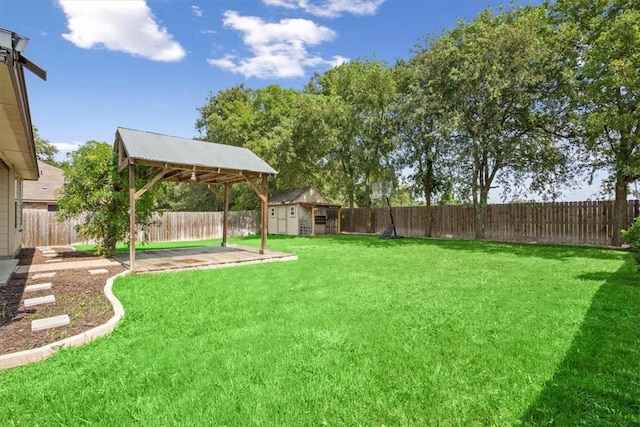 view of yard featuring a gazebo and a storage shed