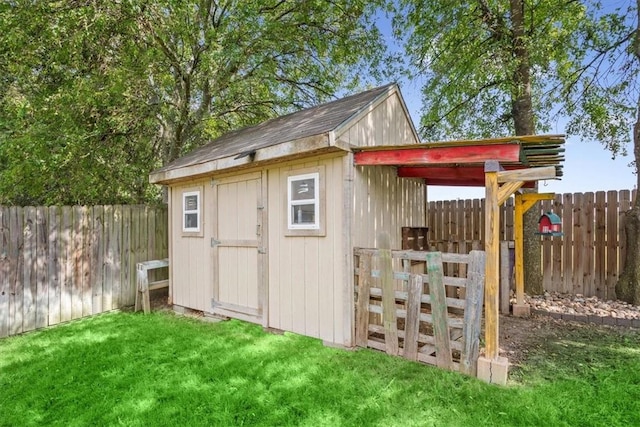 view of outbuilding featuring a yard