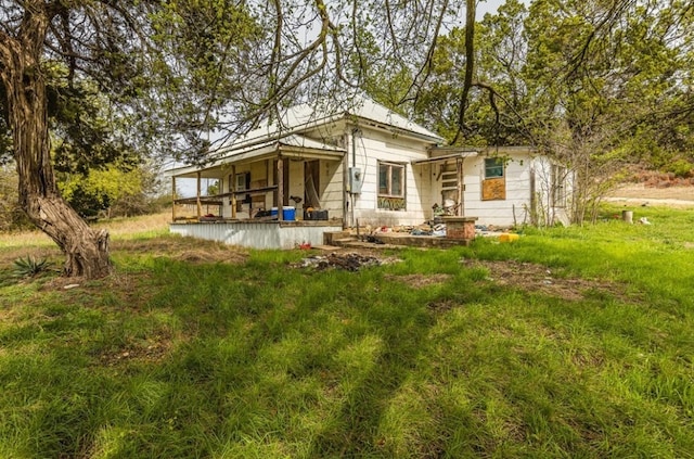 back of property featuring a porch