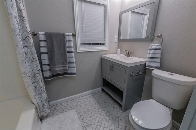 full bathroom with vanity, toilet, and shower / tub combo with curtain