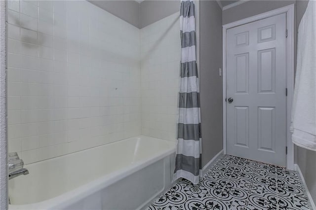 bathroom with shower / bath combo and tile patterned floors