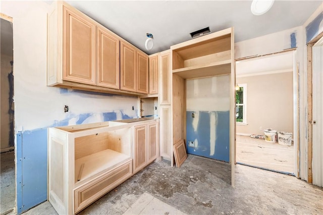 kitchen featuring light brown cabinetry