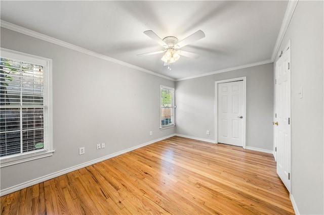 unfurnished bedroom with light wood-type flooring, multiple windows, crown molding, and ceiling fan