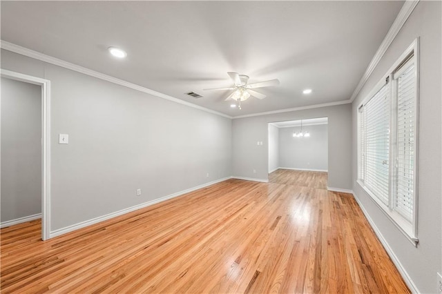 unfurnished bedroom featuring ceiling fan with notable chandelier, light hardwood / wood-style floors, and ornamental molding