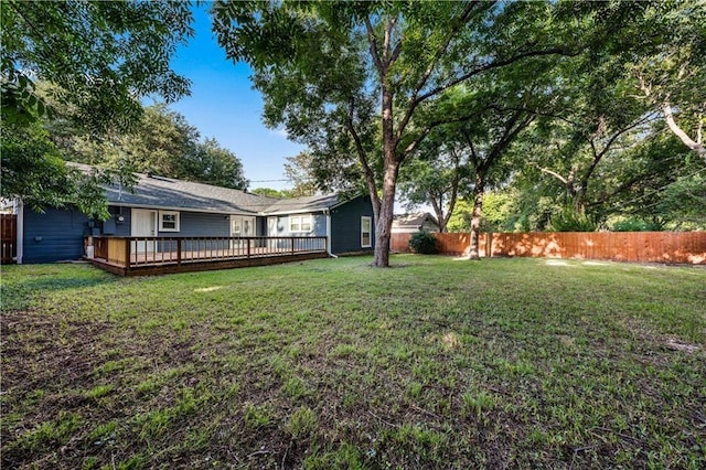 view of yard with a wooden deck