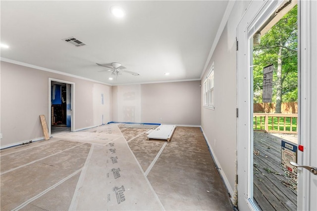 unfurnished room with plenty of natural light, ornamental molding, and ceiling fan