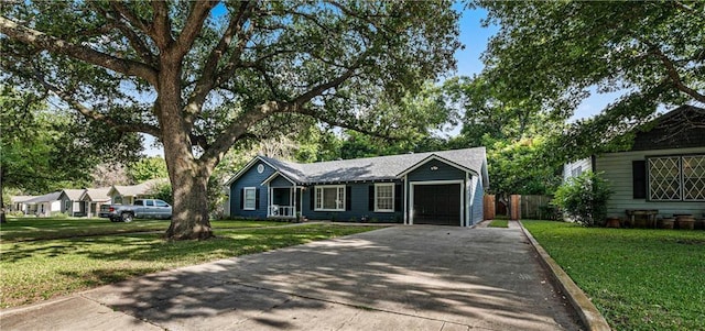 ranch-style house featuring a garage and a front yard