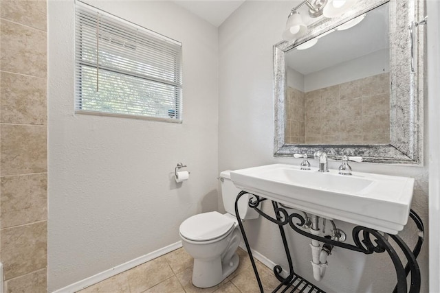 bathroom featuring tile patterned floors and toilet